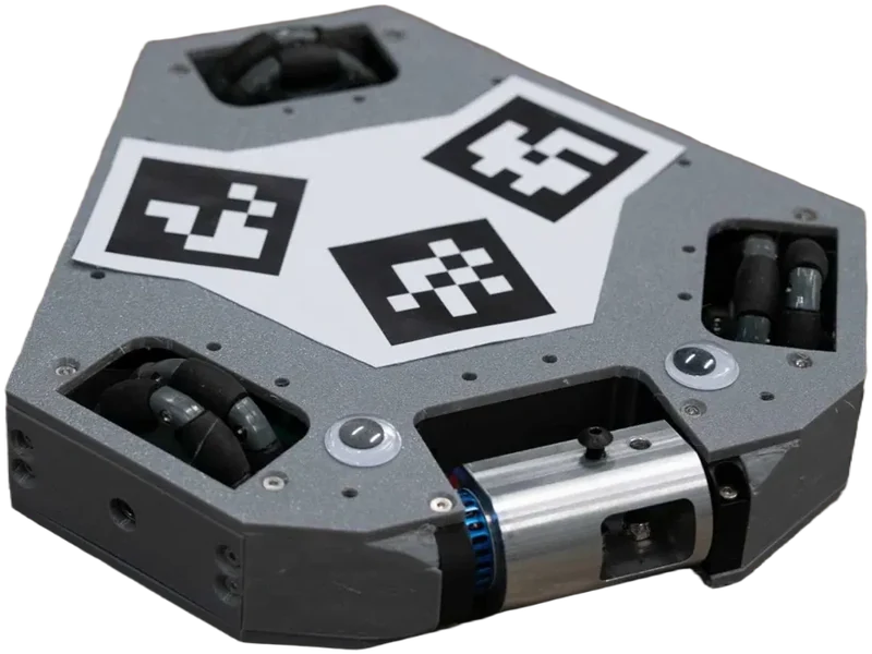 Hexagonal combat robot with ArUco markers on its lid, omni wheels and a horizontal weapon drum