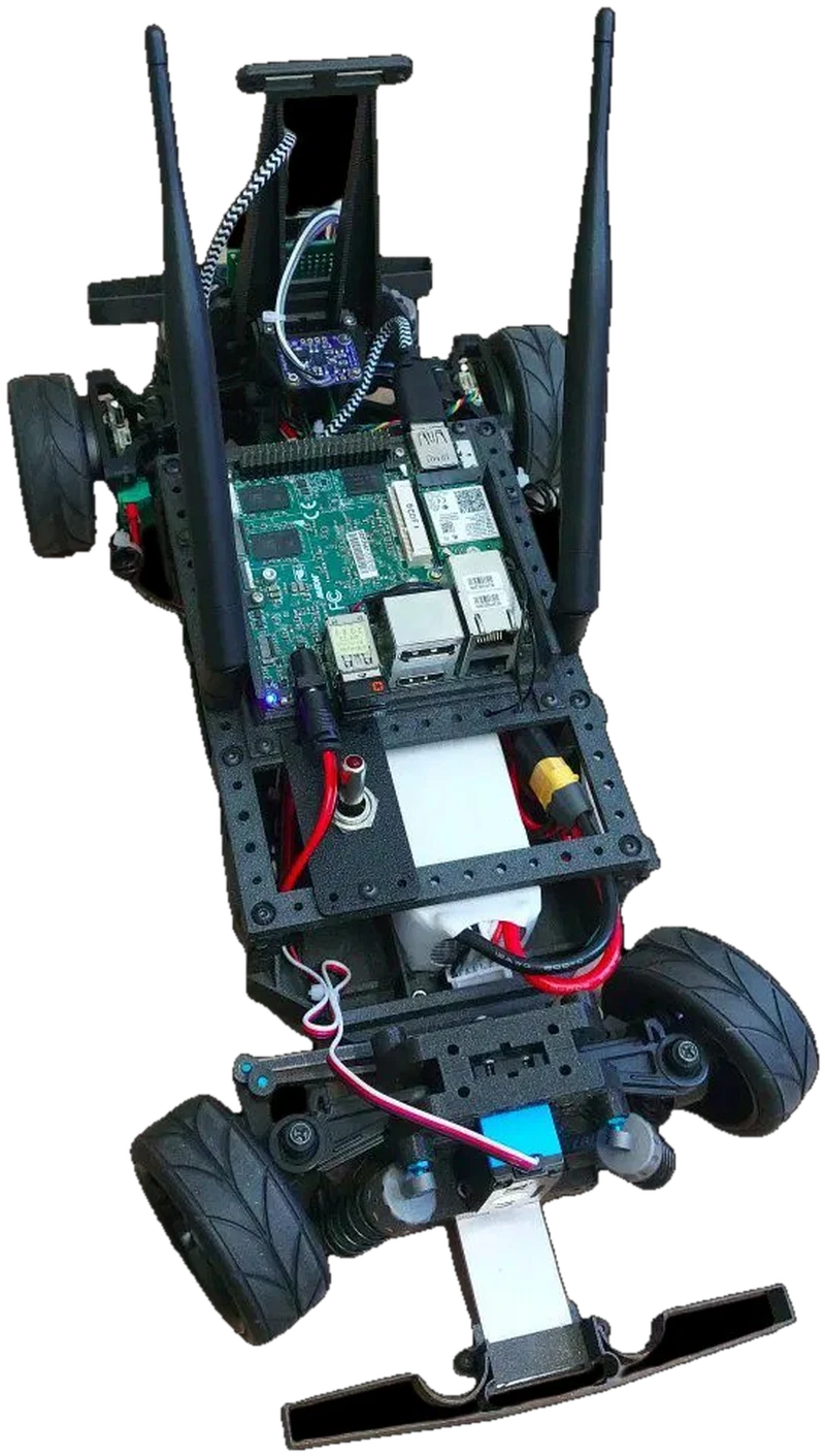 RC car chassis carrying a Raspberry Pi, antennas and a battery pack, viewed from above
